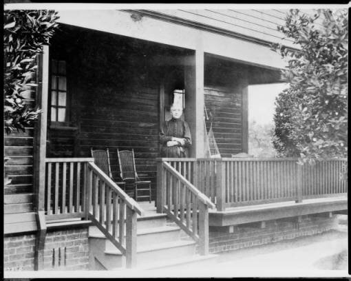 Mrs. Jessie Benton Fremont on the porch of her home, which was presented to her by a committee of ladies of the city of Los Angeles as a token of their great regard, after the death of her husband John C. Fremont.